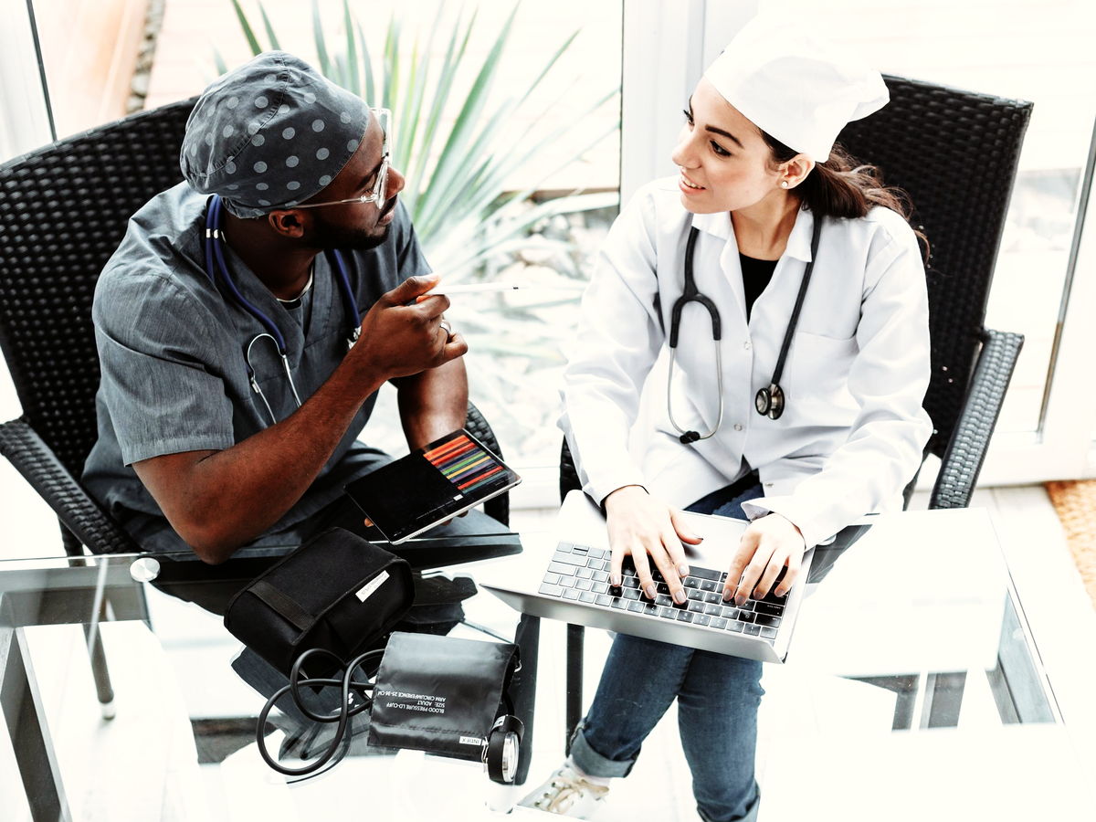 Clinical staff helping a patient